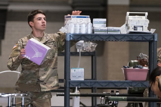 Seattle, Wash., March 30, 2020 – A soldier unloads medical equipment. Soldiers from the 627th Army Hospital based in Fort Carson, Colo., worked to set up a field hospital in the Centurylink Field Events Center. This hospital will serve as...
