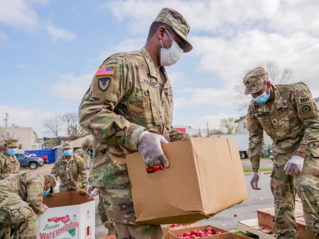 Maryland Army National Guard Soldiers help distribute food to members of the Baltimore community March 26, 2020. As of April 3, 11 states, two territories and the District of Columbia have been approved to use federal funds for state missions after Congress passed a $2.2 trillion emergency relief package to partly fund Title 32 missions. 