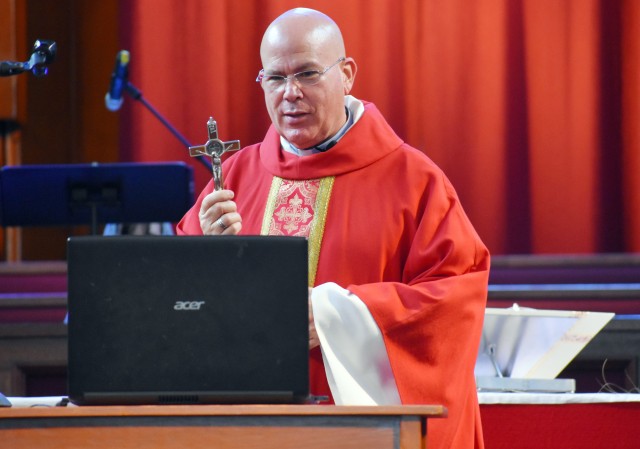 Chaplain (Lt. Col.) Alan Irizarry, operations chaplain for U.S. Army Japan and priest for the Camp Zama Holy Family Catholic Community, celebrates a livestreamed Palm Sunday Mass in the Camp Zama Chapel, Camp Zama, Japan, April 5.