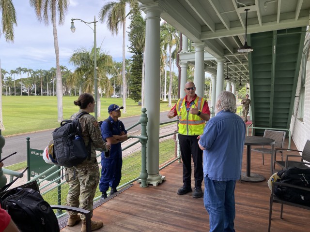 FORT SHAFTER, Hawaii (April 3, 2020) --  U S. Army Corps of Engineers Honolulu District Commander Lt. Col. Kathryn Sanborn (left) and members of the USACE site assessment team listen to team leader Jeff Herzog explain aspects of the team's mission prior to boarding a military helicopter flight to Kauai. Honolulu District is assisting the state and FEMA’s efforts with initial facility assessments at Hawaii locations.  (U.S. Army Corps of Engineers -Honolulu District photo by Meg Ryan)