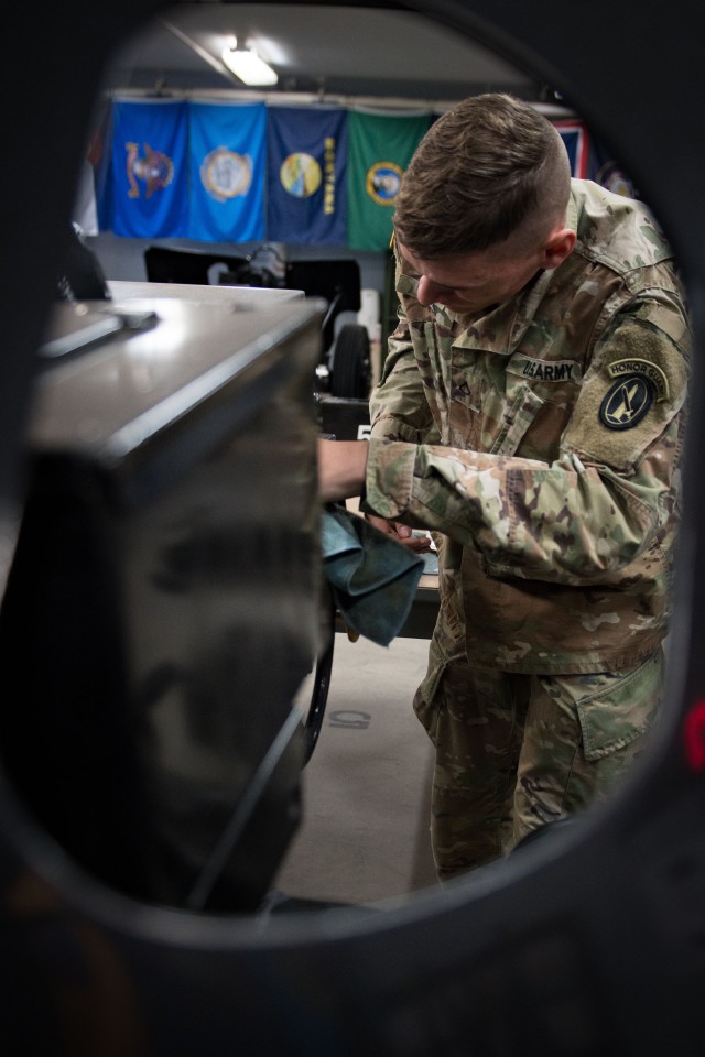 A Soldier assigned to the Presidential Salute Battery, 1st Battalion, 3d U.S. Infantry Regiment (The Old Guard) cleans a 3-inch anti-tank guns of World War II vintage, mounted on a 105mm Howitzer on Joint Base Myer-Henderson Hall, Virginia, March 25, 2020. PSB maintains their guns at all times to ensure mission readiness.