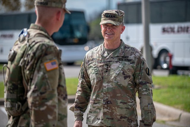 Gen. Paul E. Funk II, right, the commander of the U.S. Army Training and Doctrine Command, meets with trainees at Fort Sill, OK, on April 7, 2020. Funk visited Fort Sill to meet with leadership throughout Fort Sill and assess the measures in place to prevent the spread of COVID-19. (U.S. Army photo by Sgt. Dustin D. Biven / 75th Field Artillery Brigade)