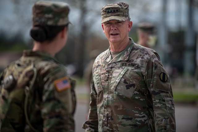 Gen. Paul E. Funk II, right, the commander of the U.S. Army Training and Doctrine Command, meets trainees at Fort Sill, OK, on April 7, 2020. Funk visited Fort Sill to meet with leadership throughout Fort Sill and assess the measures in place to...