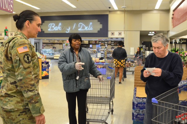 Command Sgt. Maj. Rebecca Myers, Fort Stewart Garrison’s senior enlisted leader, speaks with a Fort Stewart Commissary employee and customer on Fort Stewart, Georgia., April 3, 2020. Myers visits several places on the installation every day to...