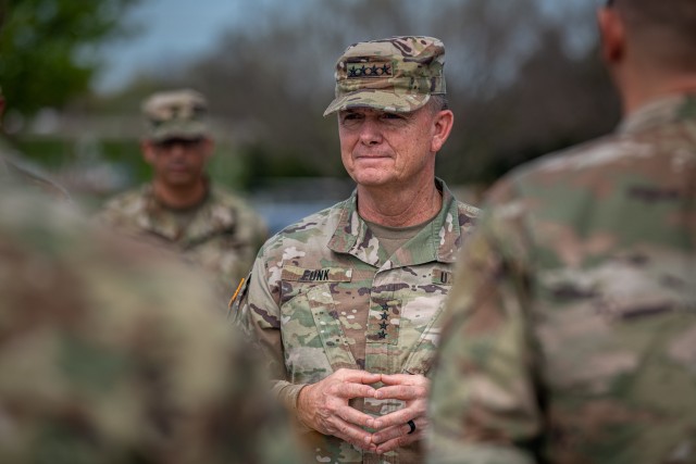 Gen. Paul E. Funk II, center, the commander of the U.S. Army Training and Doctrine Command, engages with the cadre of 428th Field Artillery Brigade at Fort Sill, OK, on April 7, 2020. Funk visited Fort Sill to meet with leadership throughout Fort Sill and assess the measures in place to prevent the spread of COVID-19. (U.S. Army photo by Sgt. Dustin D. Biven / 75th Field Artillery Brigade)