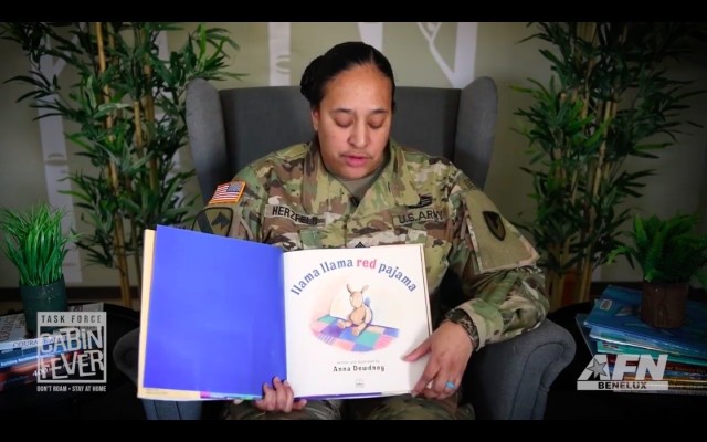 BRUSSELS -- In this screenshot, U.S. Army Garrison Benelux Command Sgt. Maj. Katrina M. Herzfeld reads Anne Dewdney's children's book Llama Llama Red Pyjama for children as part of Task Force Cabin Fever. The video is part of a series of content...