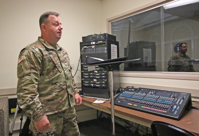 Maj. Tracy Kerr, chaplain resource manager for Fort Stewart and Hunter Army Airfield, records a Thursday devotional, March 31, at Fort Stewart’s Main Post Chapel.  Fort Stewart and Hunter Army Airfield chaplains are using prerecorded devotionals, religious services and live-streaming to maintain spiritual connections with their congregations and those who wish to tune in. (Photo by Staff Sgt. Todd Pouliot, 50th Public Affairs Detachment)