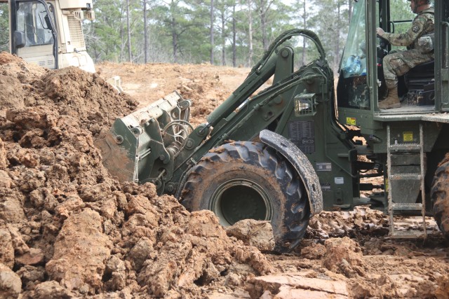 Soldiers from the 861st Engineer Support Company, Rhode Island National guard, participate in TF Spartan as part of a Rotation Augmentation Support package, Jan. 9-29, 2020, at the Joint Readiness Training Center on Fort Polk, La. Over several days, they provided a variety of force protection measures in support of friendly forces, which included constructing berms for artillery and anti-tank ditches and route clearance missions. (Photo courtesy of U.S. Army)