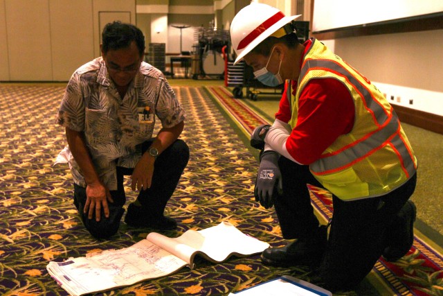 Member of the U.S. Army Corps of Engineers (USACE) Honolulu District discusses the layout of a potential COVID-19 alternate-care-facility in Kauai, Hawaii, April 3, 2020. USACE is currently looking at 114 facilities located within the United...