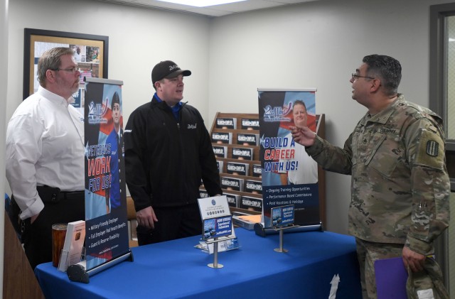Staff Sgt. Humberto Dovalina, an S3 non-commissioned officer with 2nd Battalion, 60th Infantry Regiment, speaks with a local heating and air conditioning company during the Soldier for Life-Transition Assistance Program Hiring Fair Feb. 18 at the...