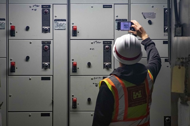 U.S. Army Corps of Engineers, Seattle District Assessment Team member Jon Springer photographs an electrical panel during an inspection at a former Yakima, Washington, hospital April 1. The hospital closed in January and Washington State...