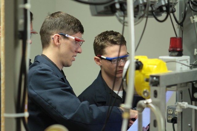 U.S. Military Academy 2018 graduates Bryce Magera and Gage Callahan, Chemical Engineering majors, conduct experiments in the Unit Operations Lab on the CO2 Absorber.