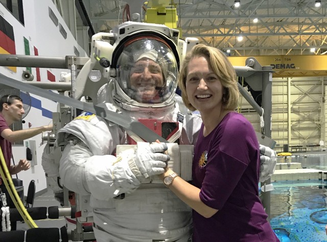 Stacey Morgan visits her husband, NASA astronaut U.S. Army Col. Andrew Morgan, at the Neutral Buoyancy Laboratory astronaut training facility at the Johnson Space Center in Houston, Texas , April 30, 2019. With less than three months before his historic flight to the International Space Station in July 2019 on the 50th anniversary of the Apollo XI lunar landing, Morgan and European Space Agency astronaut Luca Parmitano trained for up to six hours at a time in the NBL’s pool to develop procedures, verify hardware compatibility, and train for extra vehicular activities. Morgan is the commander of the U.S. Army Space and Missile Defense Command’s Army astronaut detachment. 
