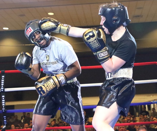 Company F-1 senior Janel Tracy (right) catches Company E-1 senior Eba Obiomon with a shot to the head during their bout at 156 pounds. Tracy, who won a BBO title in 2018, would lose the spirited three-round bout to Obiomon.