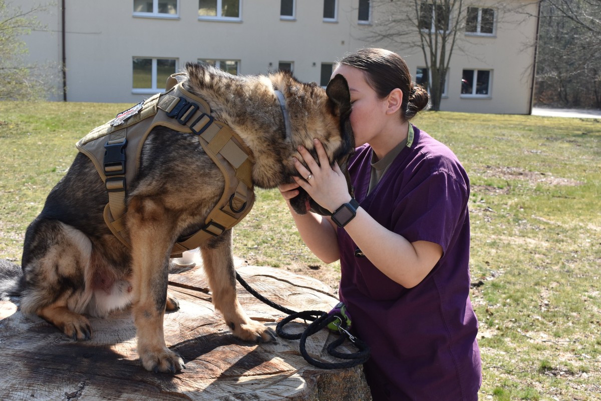  Animal  Care Specialist adopts retired Military  Working Dog 