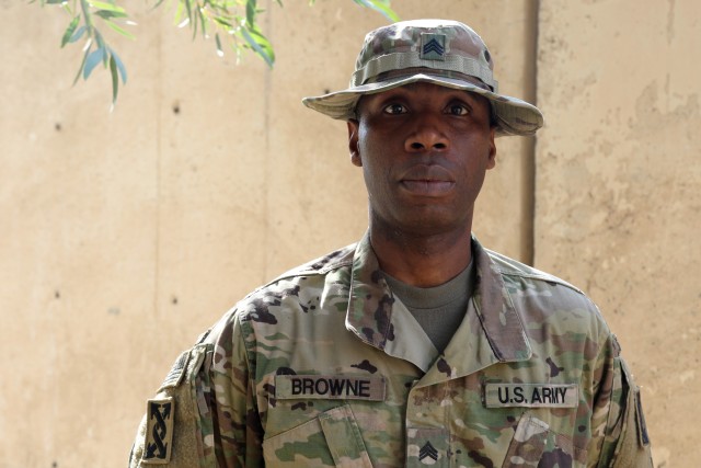 U.S. Army Staff Sgt. Thomas Browne, a native of Liberia, Africa, who became an American citizen, serves as the billeting NCO for Taji Military Complex, Iraq. As a child, Browne survived a civil war and life in refugee camps before emigrating to the United States. He became both a civilian police officer and joined the military. Shown here during his deployment Feb. 7, 2020, Browne received a promotion from his reserve unit soon afterward. Combined Joint Task Force – Operation Inherent Resolve remains unified and determined in its mission to degrade and defeat Daesh and continues to work with allies and partners to implement stabilization efforts. (U.S. Army photo  by Sgt. 1st Class Gary A. Witte)