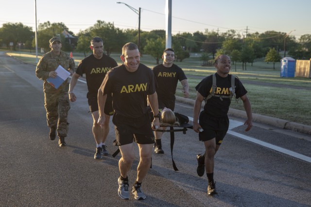 Former Command Sgt. Maj. Michael Grinston, U.S. Army Forces Command, helps carry a tactical litter during physical training at Sadowski Field A, on Fort Hood, Texas. Grinston now serves as Sgt. Maj. of the Army. (Photo by Sgt. Ryan Rayno) 