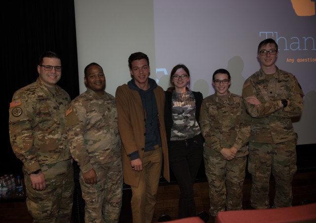 High school students pose with Soldiers after speaking with them about the life of a Soldier March 9 during a two-day community outreach tour.  On Day one, Soldiers spoke with approximately 90 high school students on their jobs, gave insight on...