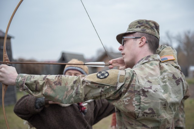During a crossbow demonstration March 9, Spc. Kyle Abke, Headquarters and Headquarters Company, 13th Expeditionary Sustainment Command, learns a near perfect technique to get a bullseye.  During a tour of the Factory, Soldiers experienced historical museum featuring a replicated traditional village with all the experiences of the Roman era. (U.S. Army photo by Sgt. 1st Class Kelvin Ringold)