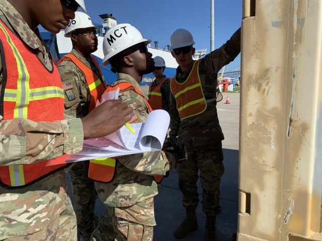 Soldiers assigned to 606th Movement Control Team, 142nd Combat Sustainment Support Battalion, 1st Armored Division Support Brigade, scan containers with handheld devices at Port of Corpus Christi, Texas, in support of 1st Armored Division Combat...