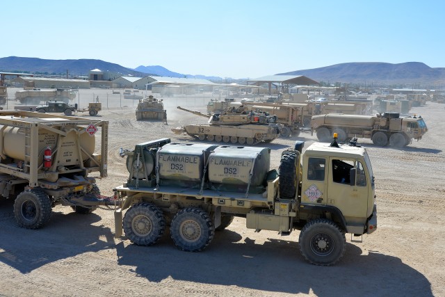 Soldiers assigned to 30th Armored Brigade Combat Team, North Carolina National Guard, prepare to roll out to their exercise area against opposing forces, Army peers who mimic weapons and tactics of real-world threats, at the National Training...