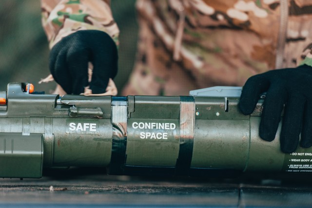 A U.S. Soldier, assigned to the 3rd Squadron, 2d Cavalry Regiment, wipes down an AT4 training rocket to mitigate the spread of COVID-19 before facilitating the Expert Infantryman Badge and the Expert Soldier Badge training in Bemowo Piskie,...