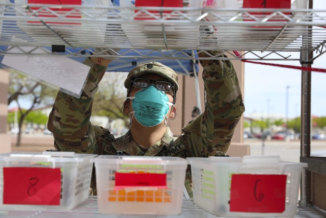 A U.S. Army Pharmacy Specialist prepares to dispense patient’s prescriptions at the William Beaumont Army Medical Center (WBAMC) curbside pharmacy service on Fort Bliss, Texas, April 6, 2020. WBAMC has implemented the new curbside pharmacy service as an additional health protection measure to help mitigate the spread of COVID-19, enabling Fort Bliss to better preserve the health and well-being of beneficiaries, staff and the El Paso community. (U.S. Army photo by: Staff Sgt. Michael L. K. West)