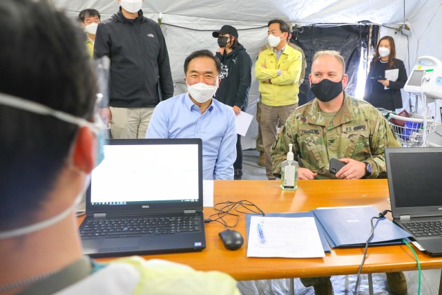 Jung Jang-seon, Pyeongtaek City mayor, and USAG Humphreys commander, Col. Michael F. Tremblay, visit the Brian D. Allgood Army Community Hospital tertiary tent, April 9. The mayor also visited the intensive care unit, testing lab, Exchange and...
