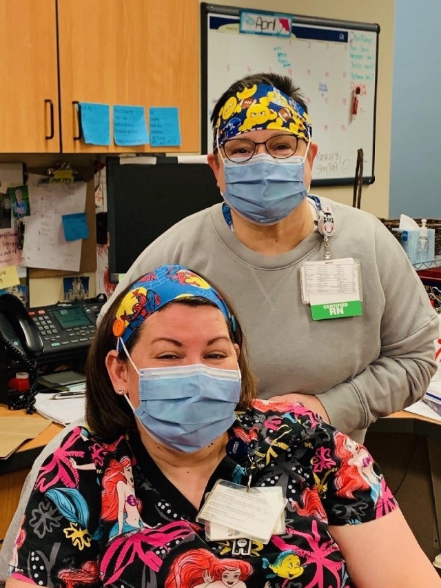 Nurses at Norton Children’s Hospital in Louisville, Ky., model the masks and headbands made by AMCOM Safety Director Pat Vittitow. Jennifer Forcht, seated, and Stephanie Cline, Vittitow’s sister, standing, are nurses in the hospital’s Pediatric Palliative Care Unit.