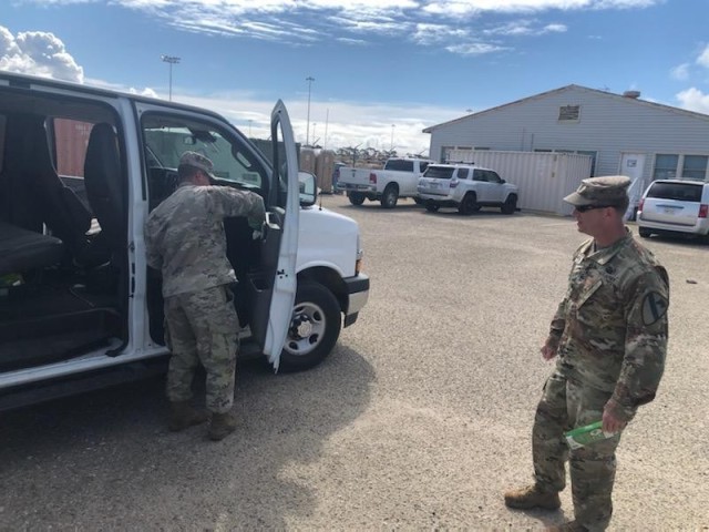 PORT HUENEME, California—Soldiers with 3rd Armored Brigade Combat Team, 1st Cavalry Division clean a van used to transport Soldiers to the port during vehicle download operations March 25. The Soldiers conducted redeployment operations for the Brigade during the COVID-19 outbreak.