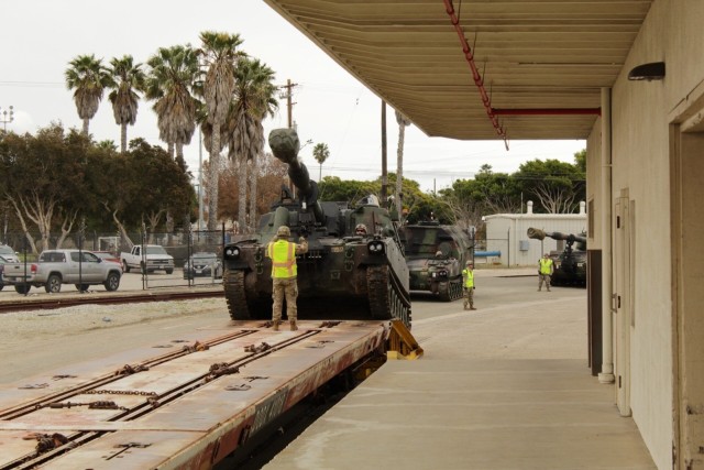 PORT HUENEME, California—Soldiers with 3rd Armored Brigade Combat Team, 1st Cavalry Division load a Paladin self-propelled artillery vehicle during redeployment operations here March 20. The Soldiers conducted redeployment operations for the Brigade during the COVID-19 outbreak.