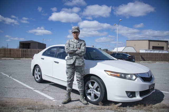 Air Force Airman Amanda Edwards, a logistics planner with the 97th Logistics Readiness Squadron, stands in front of her car at Altus Air Force Base, Okla., Feb. 24, 2020. Edwards saved enough money to buy a car, tag, title and six months of...