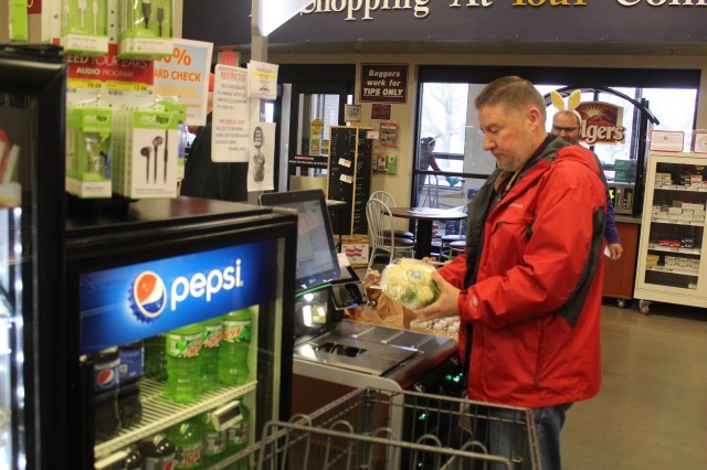 Harry Hughes with the Installation Legal Office at Fort McCoy, Wis., uses a self checkout April 3, 2020, at the Fort McCoy Commissary. Since the installation’s response to the COVID-19 pandemic began in March 2020, the Fort McCoy Commissary...