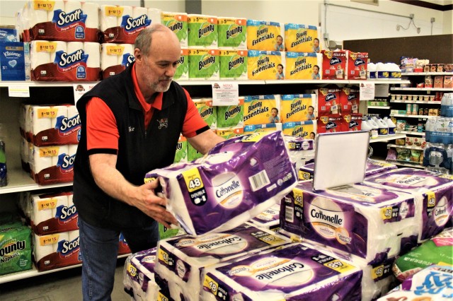 Defense Commissary Agency employee Mike Graham stocks supplies April 3, 2020, at the Fort McCoy (Wis.) Commissary. Since the installation’s response to the COVID-19 pandemic began in March 2020, the Fort McCoy Commissary staff continued to take...