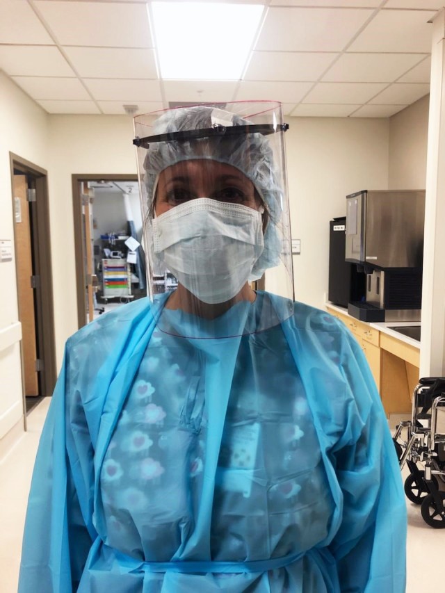 Linda Raftery, an ER Nurse at Keller Army Community Hospital, wears one of the 70 face shield made by the U.S. Military Academy department of civila and mechanical engineering. (Courtesy photo)