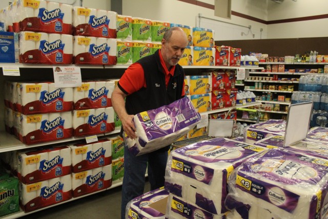Defense Commissary Agency employee Mike Graham stocks supplies April 3, 2020, at the Fort McCoy (Wis.) Commissary. Since the installation’s response to the COVID-19 pandemic began in March 2020, the Fort McCoy Commissary staff continued to take...