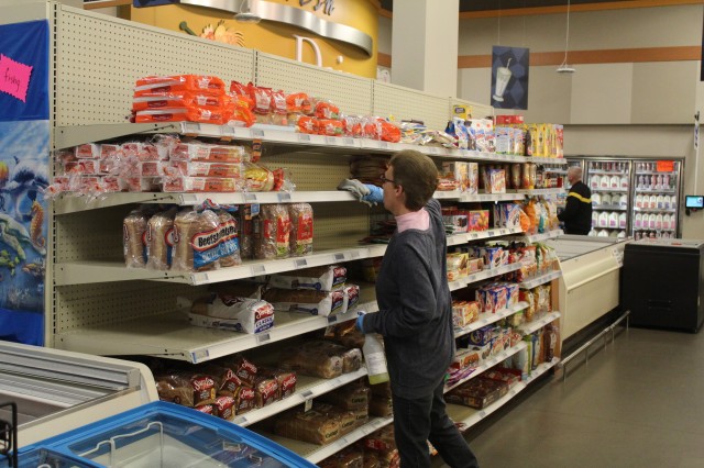 A worker wipes down a shelf area April 3, 2020, at the Fort McCoy Commissary at Fort McCoy, Wis. Since the installation’s response to the COVID-19 pandemic began in March 2020, the Fort McCoy Commissary staff continued to take steps to protect...