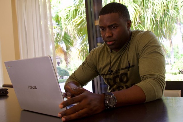 Army Spc. Olardo Lawrence of the Florida Army National Guard works on an assignment for his quantitative methods class in West Palm Beach, Fla., April 4, 2020. Lawrence is enrolled in Polk State College and is just 18 credits shy of completing his...