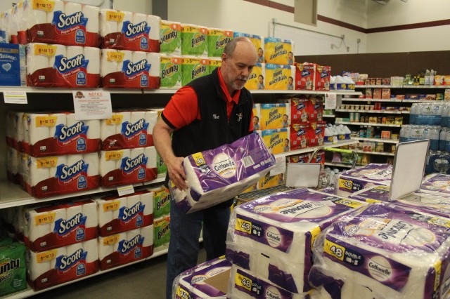 Defense Commissary Agency employee Mike Graham stocks supplies April 3, 2020, at the Fort McCoy (Wis.) Commissary. Since the installation’s response to the COVID-19 pandemic began in March 2020, the Fort McCoy Commissary staff continued to take...