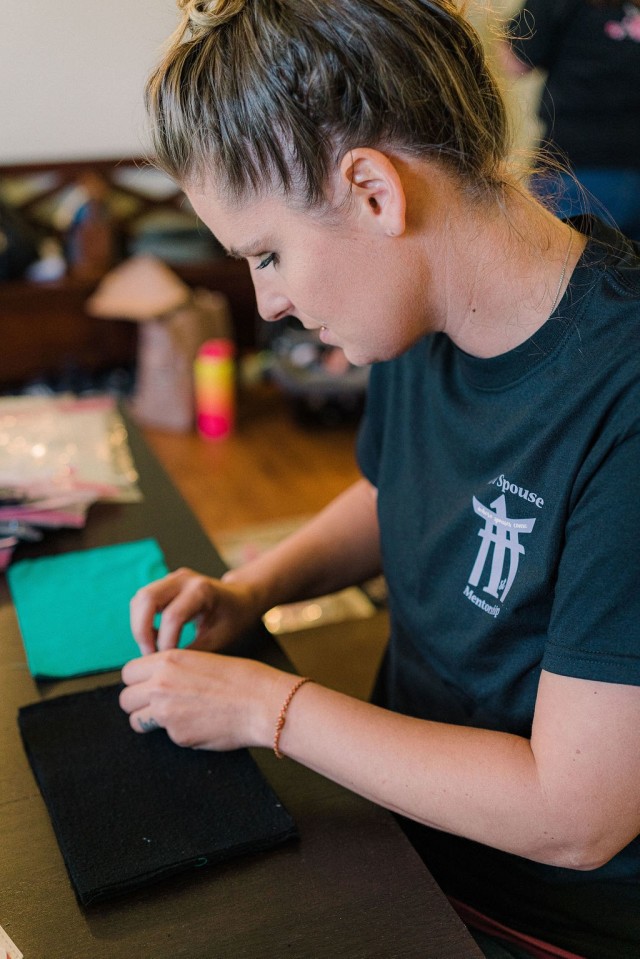 Kati Poston, 1st Battalion F.I.R.S.T. Spouse Mentorship Group chair, counts fabric squares in preparation for pressing in Okinawa, Japan, Mar. 29, 2020. The spouses have contributed masks to the Emergency Response Center and the emergency department of the U.S. Naval Hospital Okinawa for medical personnel to safely render the proper care during the COVID-19 pandemic. (Courtesy photo by Lisa Song)