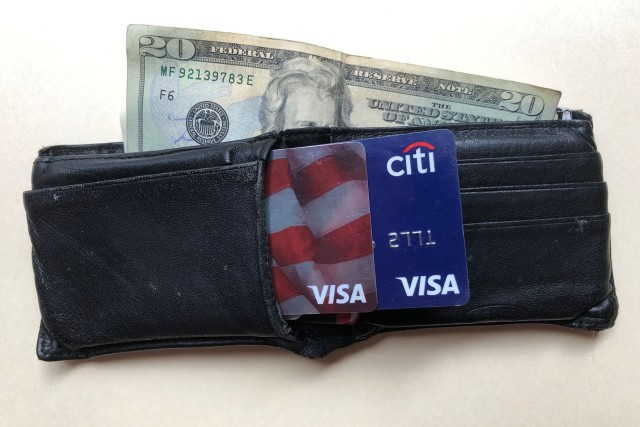 A wallet with cash and credit cards.