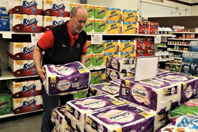 Defense Commissary Agency employee Mike Graham stocks supplies April 3, 2020, at the Fort McCoy (Wis.) Commissary. Since the installation’s response to the COVID-19 pandemic began in March 2020, the Fort McCoy Commissary staff continued to take...