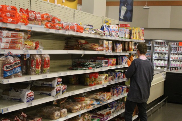A worker wipes down a shelf area April 3, 2020, at the Fort McCoy Commissary at Fort McCoy, Wis. Since the installation’s response to the COVID-19 pandemic began in March 2020, the Fort McCoy Commissary staff continued to take steps to protect...