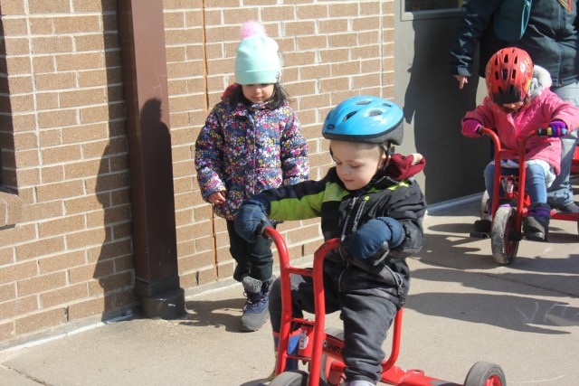 A student at the Child Development Center (CDC) rides a bike March 17, 2020, at Fort McCoy, Wis. The CDC is Department of Defense certified and nationally accredited. (U.S. Army photo by Aimee Malone, Public Affairs Office, Fort McCoy, Wis.)