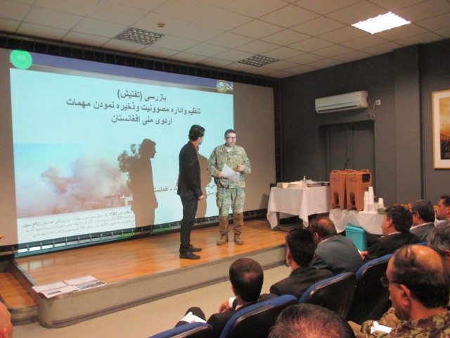 Quality Assurance Specialist (Ammunition Surveillance) Frank Wilson with his Combined Security Transition Command-Afghanistan (CSTC-A) interpreter, training Ammunition Explosive Safety to members of the Afghanistan Ministry of Defense Inspector...