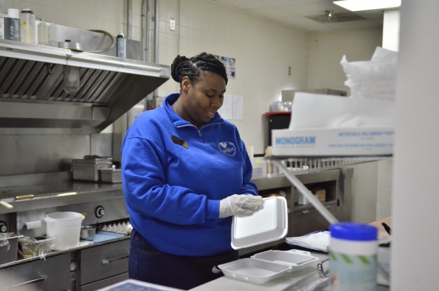 Alise Purcell, recreation assistant at MWR to Go, prepares a pick-up order, April 3, at MWR to Go, 5380 Tennessee Avenue. MWR to Go now offers a combined breakfast, lunch, and dinner menu from the various Morale, Welfare and Recreation eateries on...