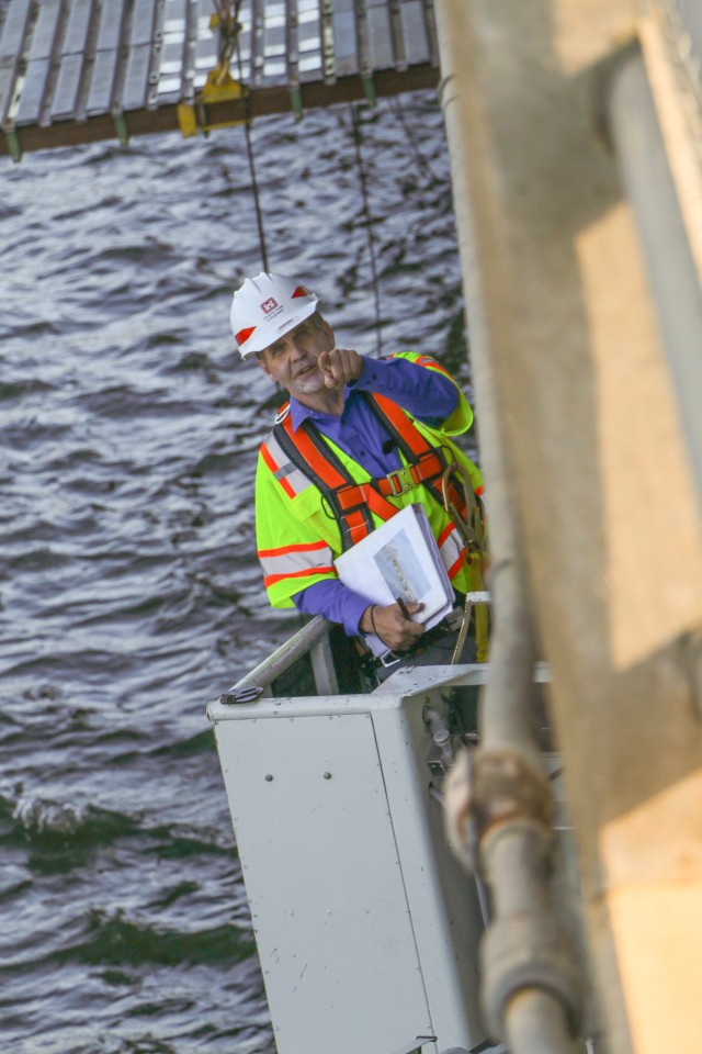 Lyle Peterson, civil engineer, U.S. Army Corps of Engineers, Omaha District, uses a snooper Sept. 23, 2019, to inspect the underside of one of the bridges spanning the Missouri River at the Big Bend Dam near Fort Thompson, S.D.