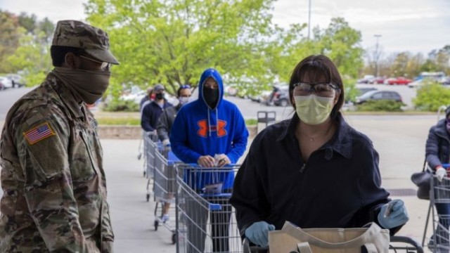 Patrons in face coverings line up outside the Fort Meade Commissary as required by the Defense Commissary Agency since Monday. Beginning Friday, face coverings will be mandatory at all high-occupancy facilities on Fort Meade to reduce the spread of the coronavirus.