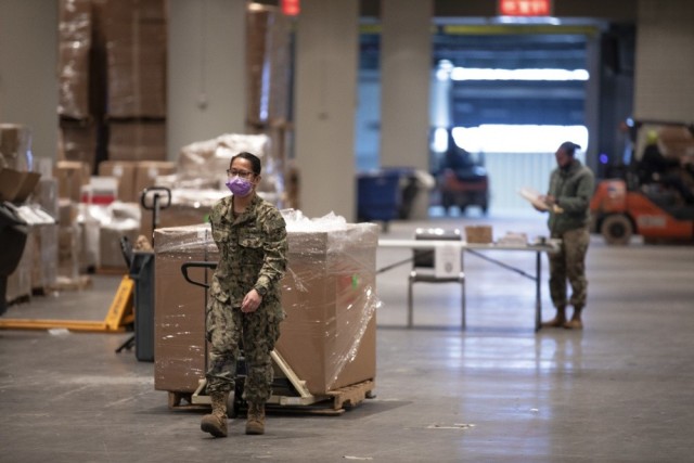 : U.S. Navy Logistics Specialist 1st Class Emmeline Manaois, moves medical supplies to be counted and distributed within Javits New York Medical Station, N.Y. April 11, 2020, in support of the Department of Defense COVID-19 response. U.S. Northern...