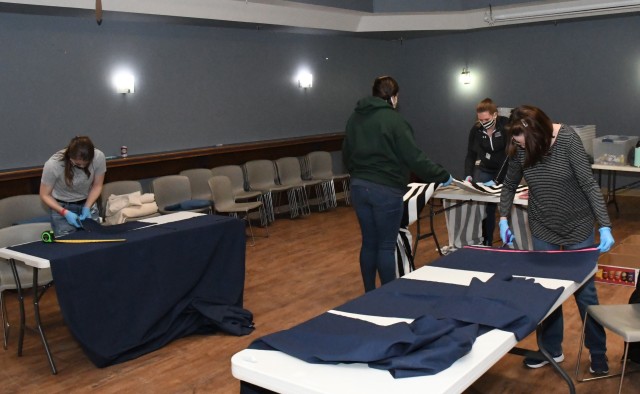 Volunteers at the Fort Drum USO Center assembled roughly 600 face mask kits April 16 that will be distributed to community members on post. This is one of many programs and activities the USO is involved with to support the community during the Coronavirus (COVID-19) pandemic. (Photo by Mike Strasser, Fort Drum Garrison Public Affairs)